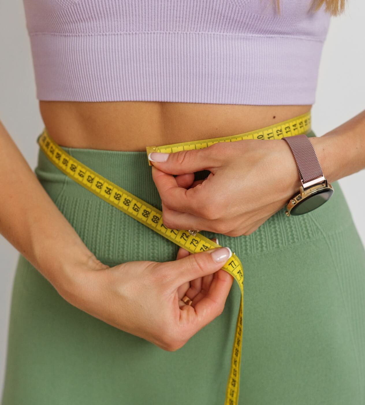 slim-woman-measuring-her-waist-by-measure-tape-cl-2023-11-27-05-08-12-utc (1)