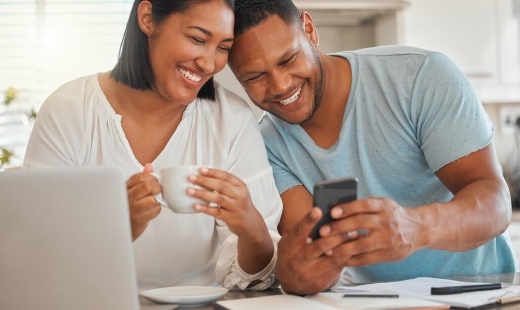 shot-of-a-man-showing-his-wife-something-on-his-ce-2023-11-27-04-58-04-utc (1)