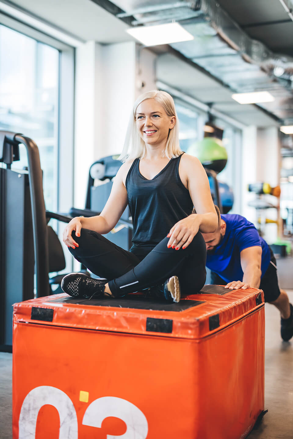happy-woman-sitting-on-weight-pushed-by-a-man-2025-03-25-15-20-59-utc (1)